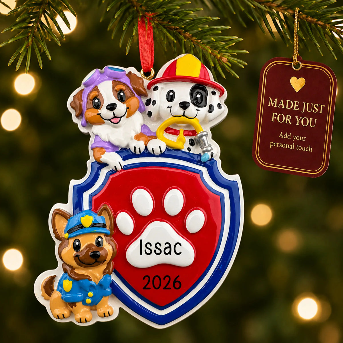Puppy rescue squad christmas ornament hanging on a lit Christmas tree with a Made Just For You gift tag