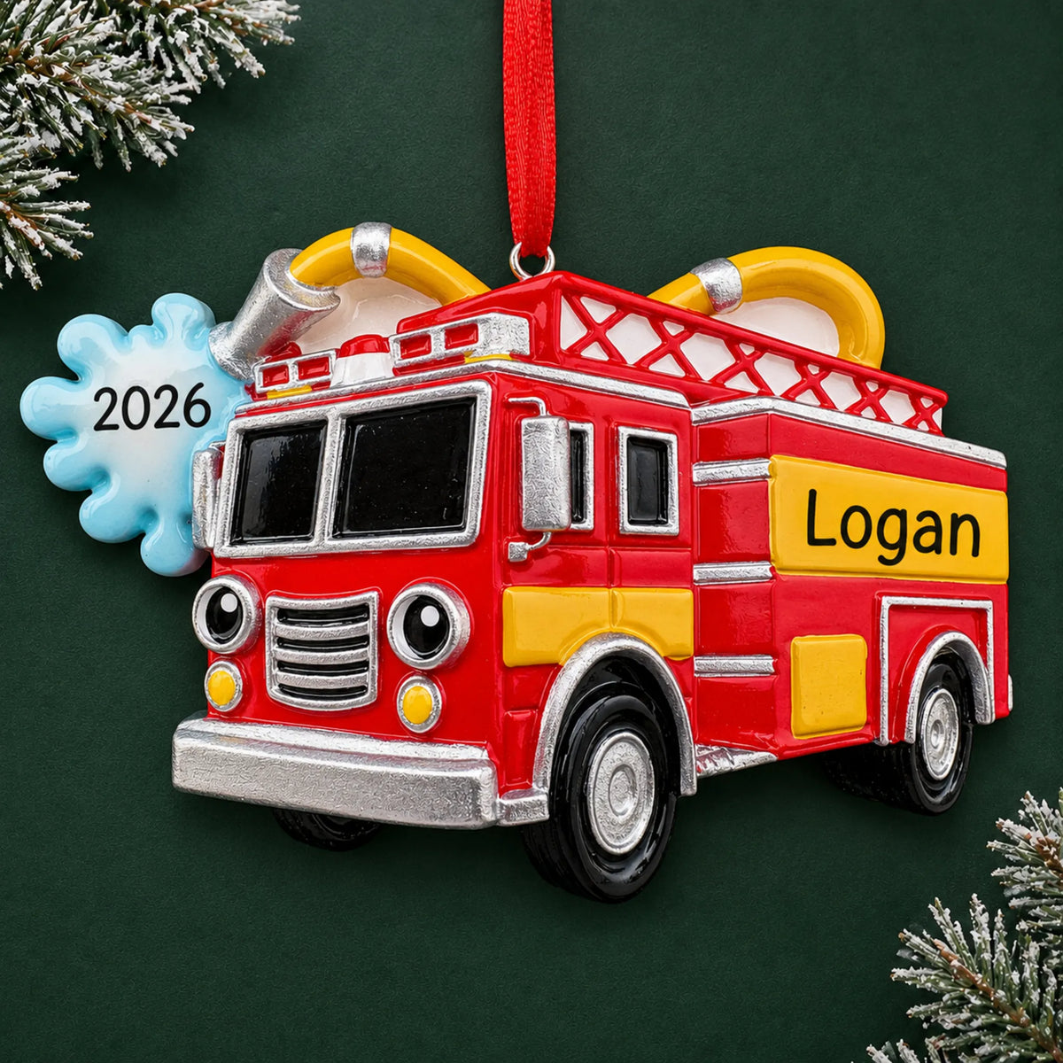 Personalized firetruck with hose christmas ornament on a dark green pine background