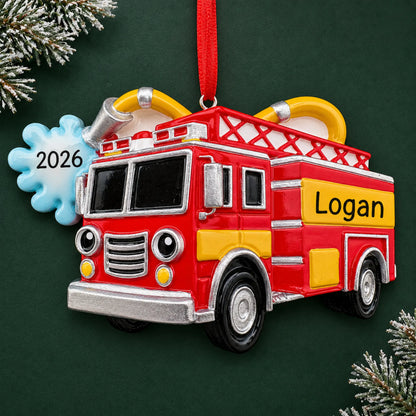 Personalized firetruck with hose christmas ornament on a dark green pine background