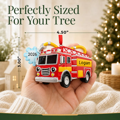 Size guide: the personalized firetruck with hose christmas ornament is 4.50 in wide by 3.00 in tall, shown in hand