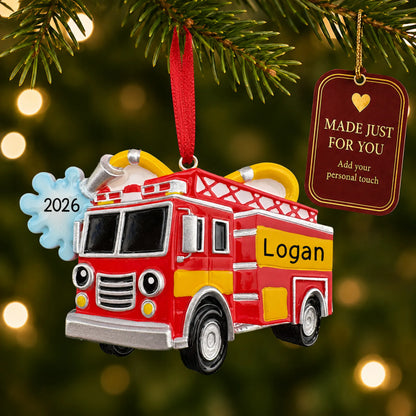 Firetruck with hose christmas ornament hanging on a lit Christmas tree with a Made Just For You gift tag