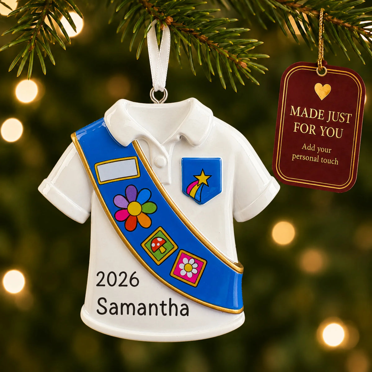 Girl Scout blue sash christmas ornament hanging on a lit Christmas tree with a Made Just For You gift tag