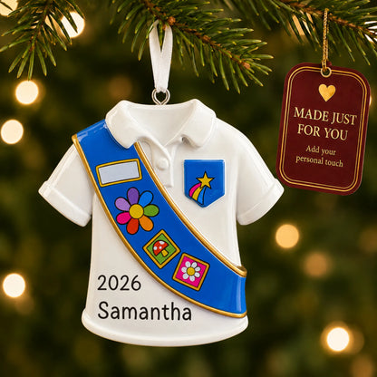 Girl Scout blue sash christmas ornament hanging on a lit Christmas tree with a Made Just For You gift tag