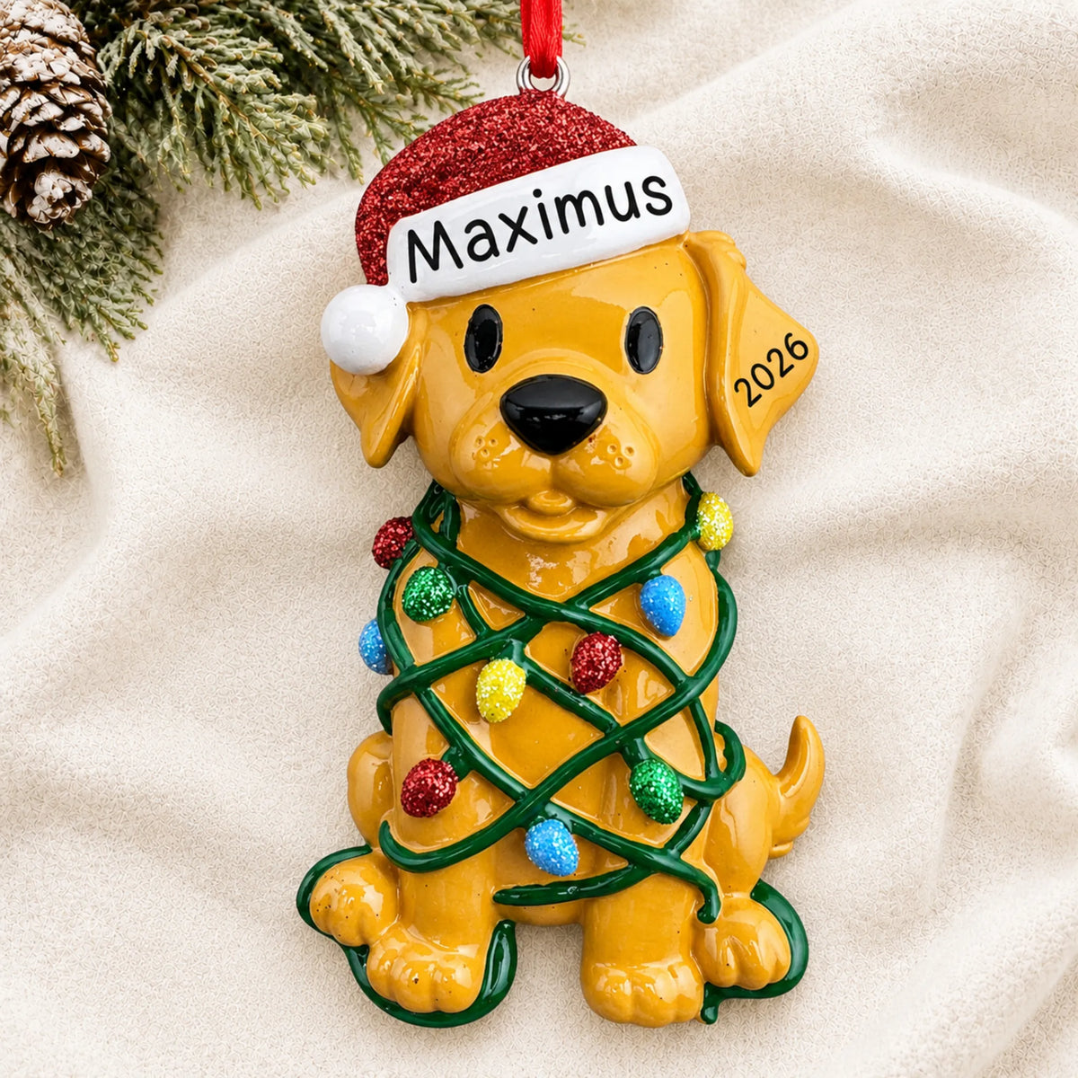 Personalized Dog In Christmas Lights ornament laid on a soft white knit blanket
