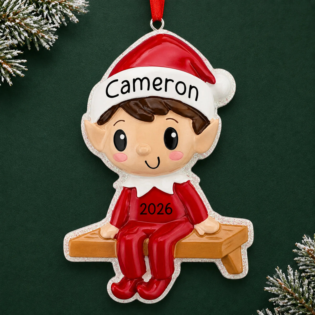 Personalized Christmas Elf ornament on a dark green pine background