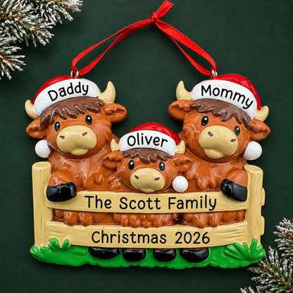 Personalized highland cow family of 3 christmas ornament on a dark green pine background