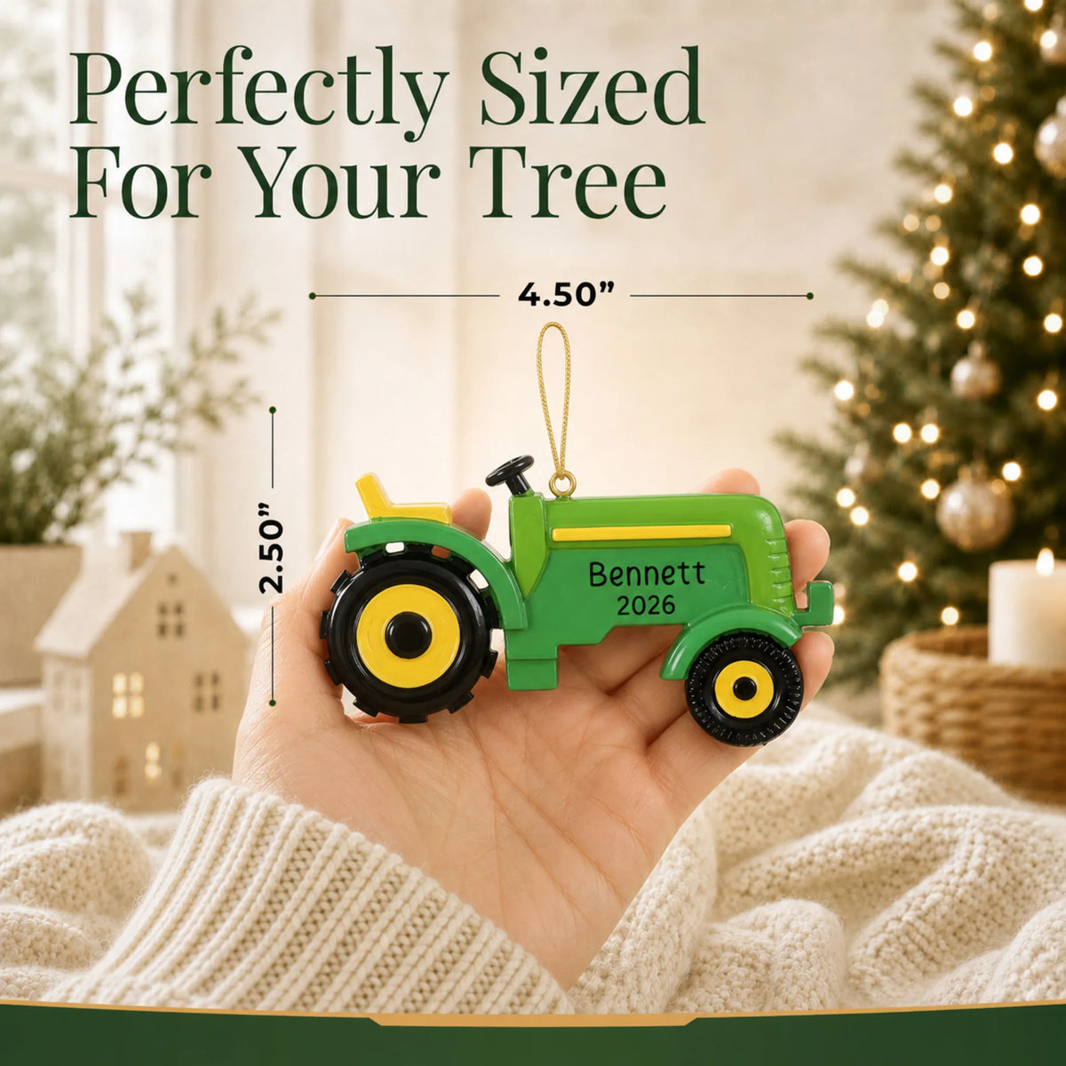 Size guide: the personalized farm tractor christmas ornament is 4.50 in wide by 2.50 in tall, shown in hand