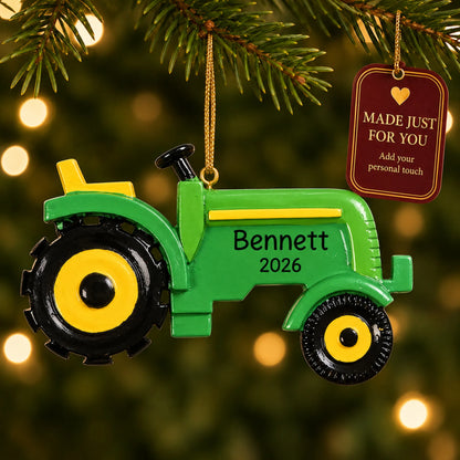Farm tractor christmas ornament hanging on a lit Christmas tree with a Made Just For You gift tag