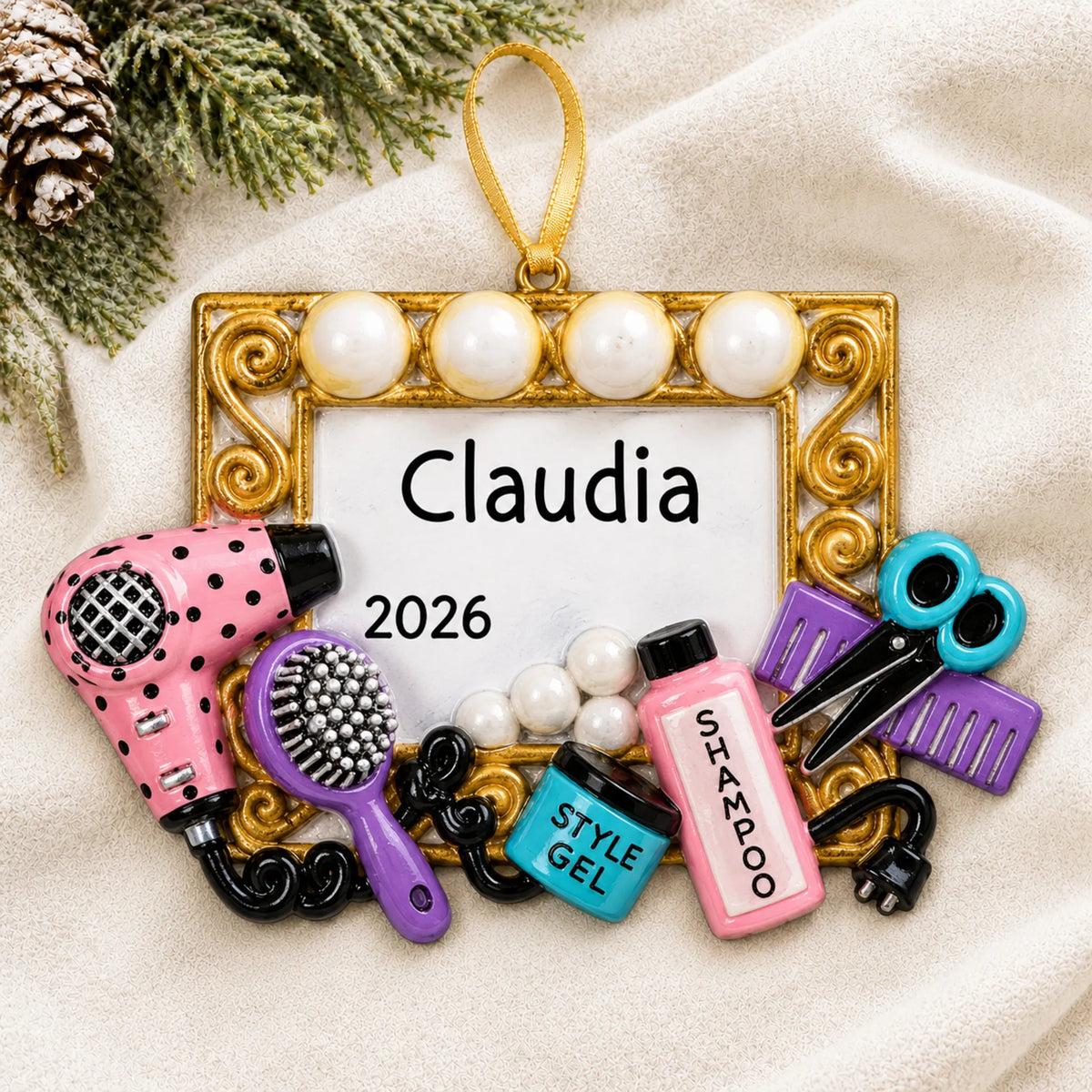 Personalized hair stylist christmas ornament laid on a soft white knit blanket