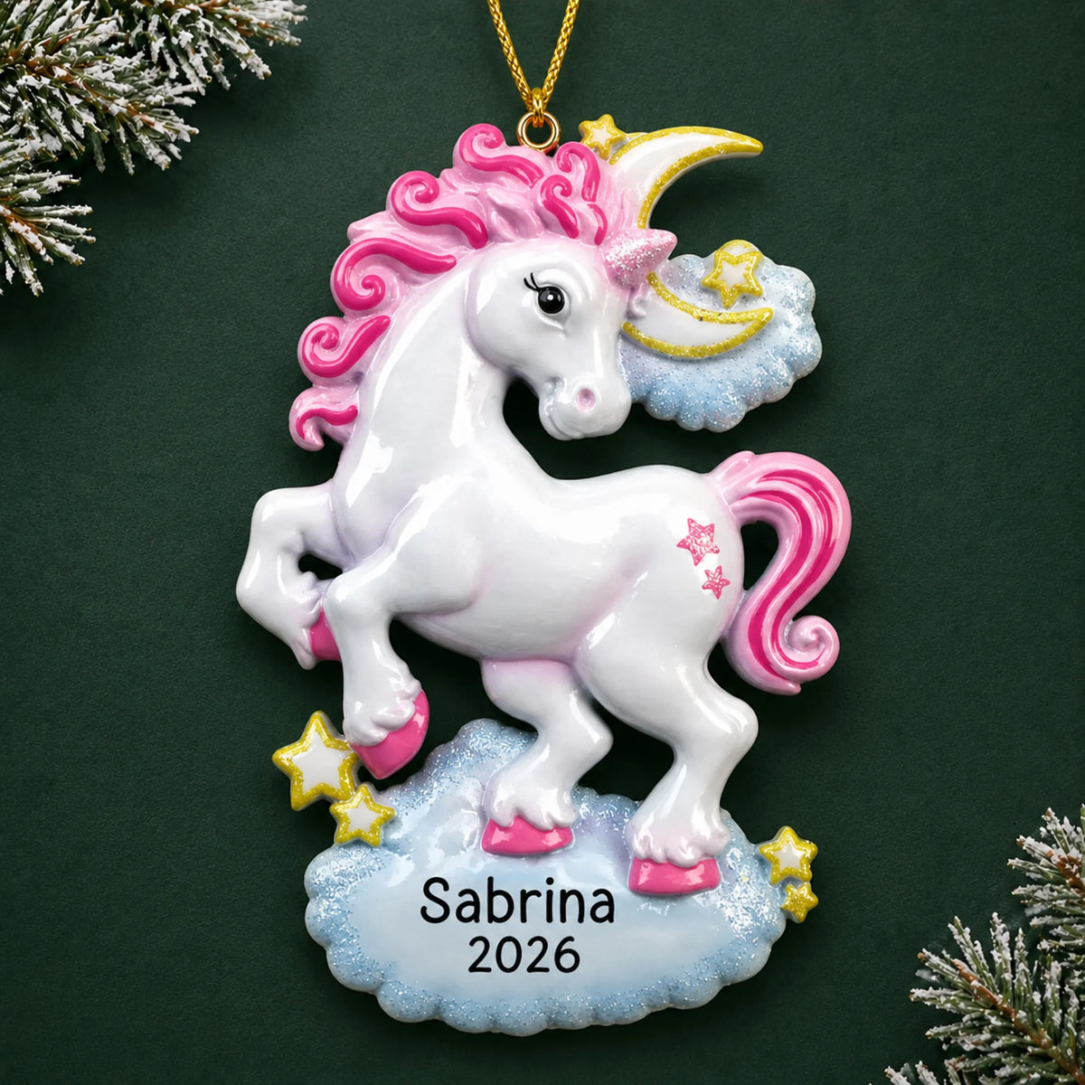 Personalized unicorn sparkles christmas ornament on a dark green pine background
