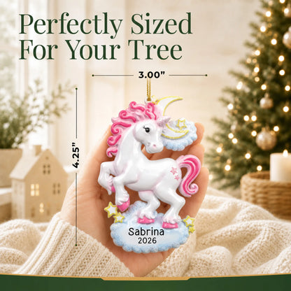 Size guide: the personalized unicorn sparkles christmas ornament shown in hand next to a Christmas tree