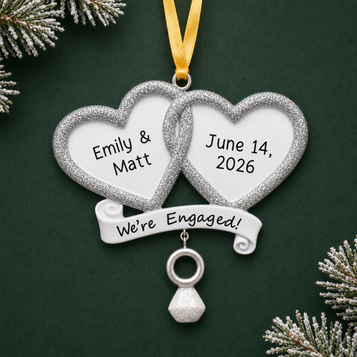 Personalized We're Engaged double heart Christmas ornament with two glitter hearts with names, date and a ring charm