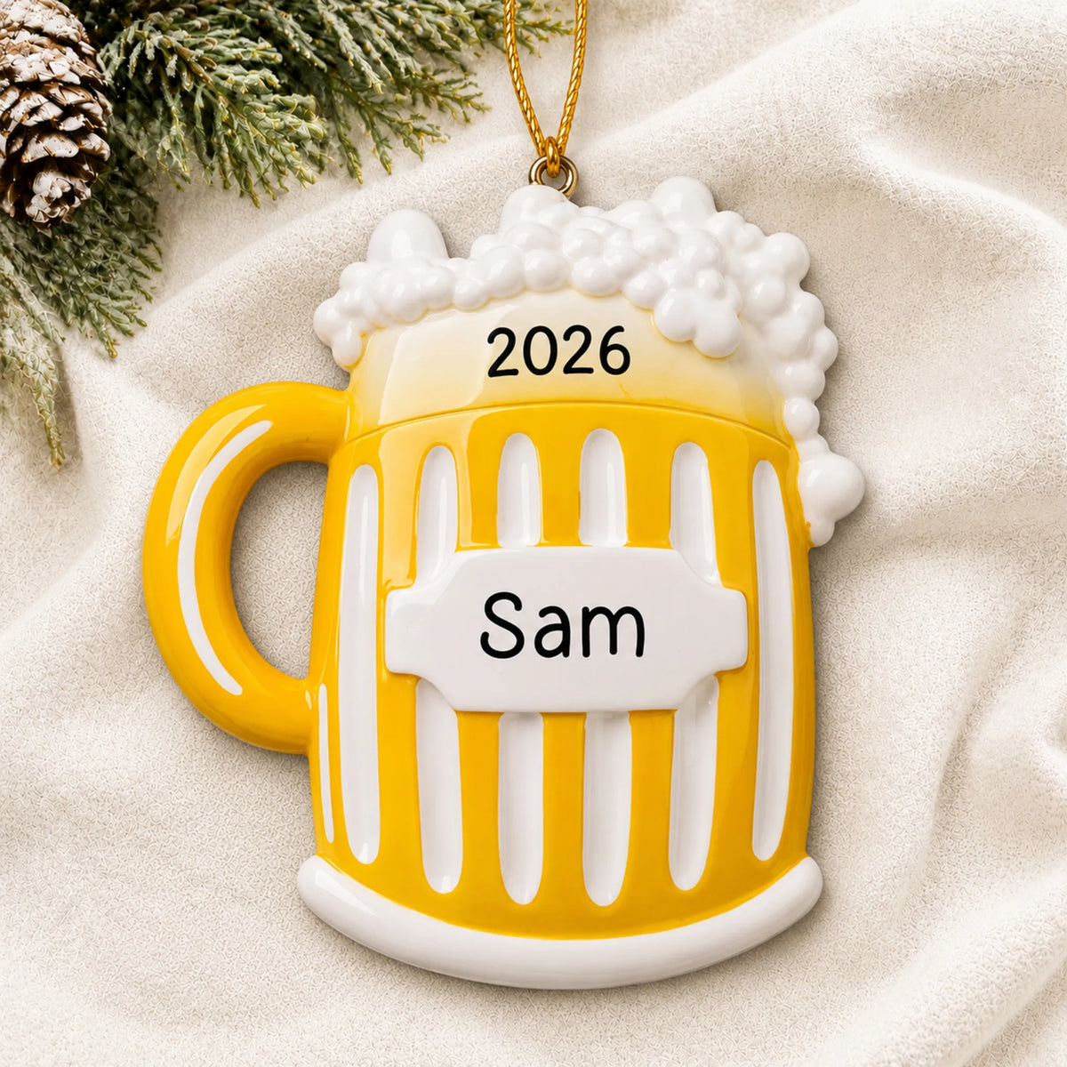 Personalized Beer Mug christmas ornament laid on a soft white knit blanket