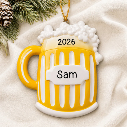 Personalized Beer Mug christmas ornament laid on a soft white knit blanket