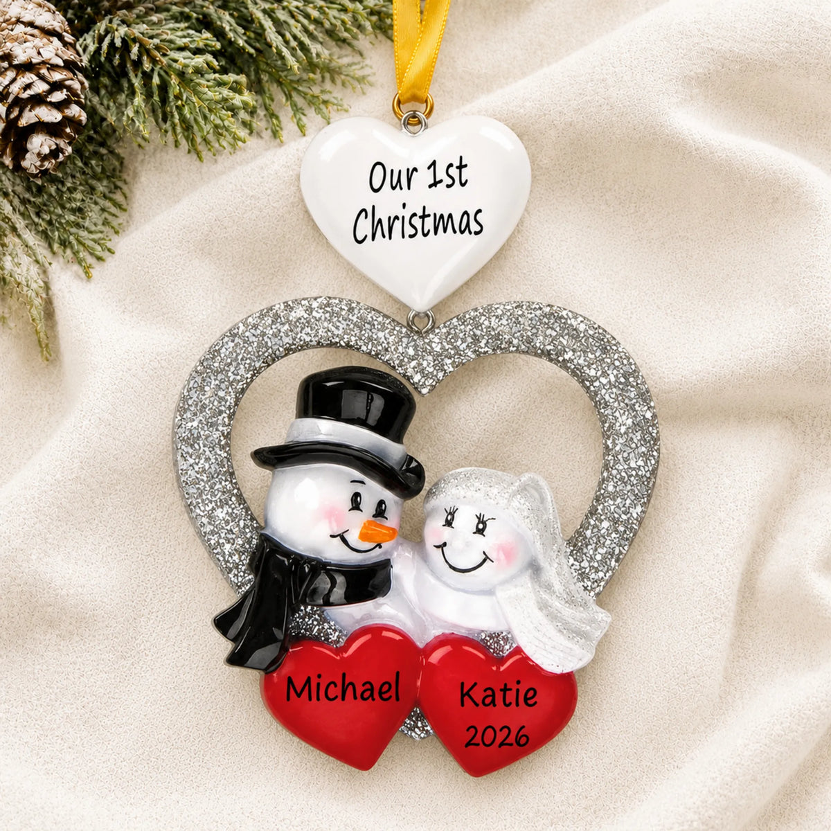 Personalized Wedding Couple First Christmas ornament laid on a soft white knit blanket