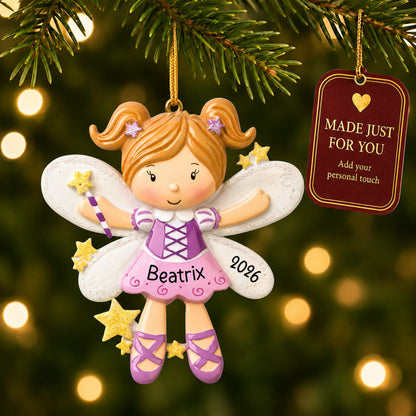 Fairy christmas ornament hanging on a lit Christmas tree with a Made Just For You gift tag