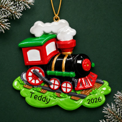 Personalized choo choo train christmas ornament on a dark green pine background