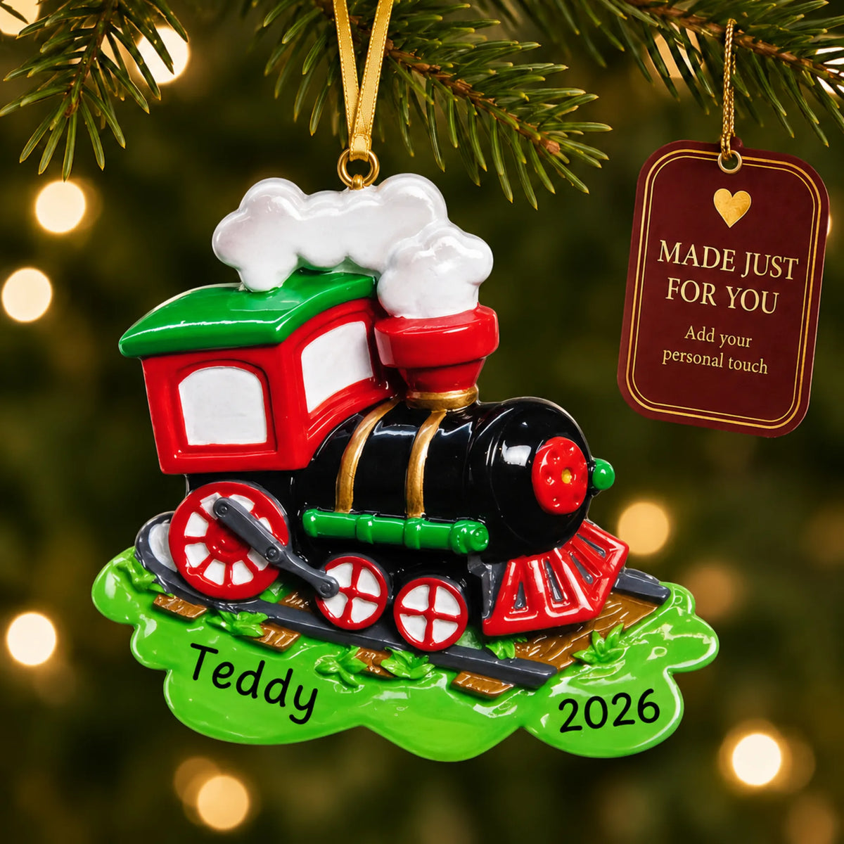 Choo choo train christmas ornament hanging on a lit Christmas tree with a Made Just For You gift tag