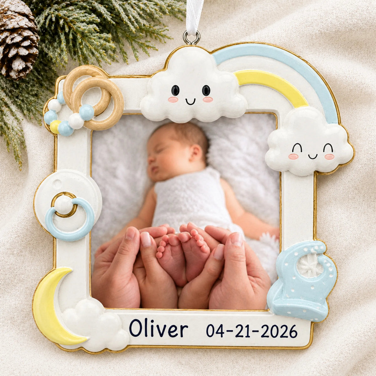 Personalized baby boy photo frame christmas ornament laid on a soft white knit blanket