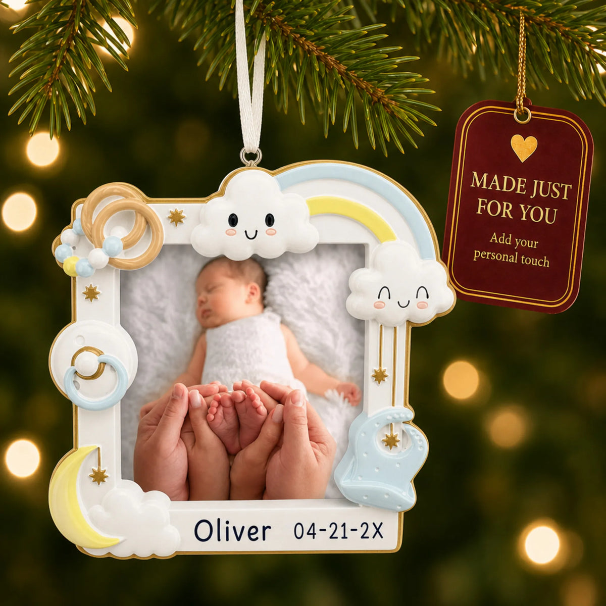 Baby boy photo frame christmas ornament hanging on a lit Christmas tree with a Made Just For You gift tag