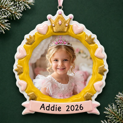 Personalized princess crown photo frame christmas ornament on a dark green pine background