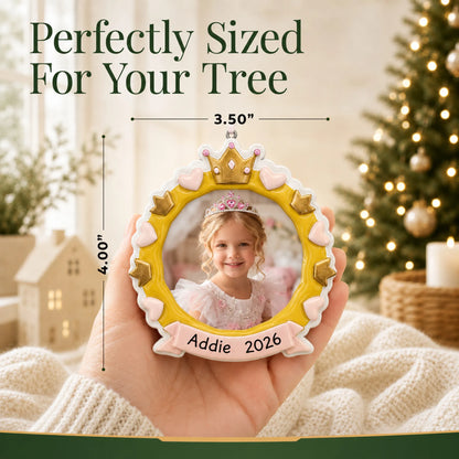 Size guide: the personalized princess crown photo frame christmas ornament is 3.50 in wide by 4.00 in tall, shown in hand