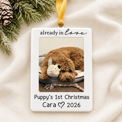 Personalized Already in Love Puppy Photo Frame christmas ornament laid on a soft white knit blanket