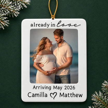Personalized Expecting Couple Photo Frame christmas ornament on a dark green pine background