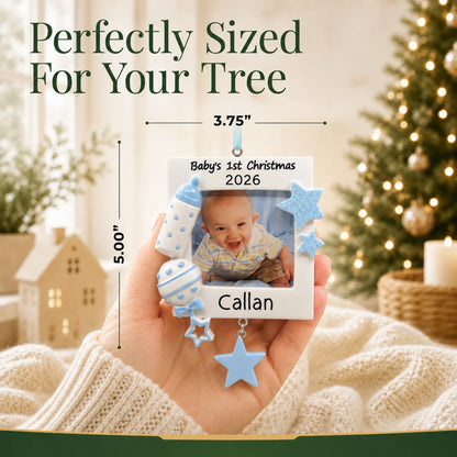 Size guide: the personalized blue baby's first picture frame christmas ornament shown in hand next to a Christmas tree