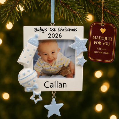 Blue baby's first picture frame christmas ornament hanging on a lit Christmas tree with a Made Just For You gift tag