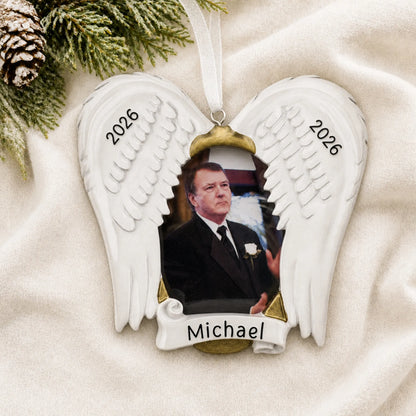 Personalized In Loving Memory Photo Frame christmas ornament laid on a soft white knit blanket