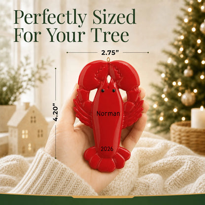Size guide: the personalized lobster christmas ornament is 2.75 in wide by 4.20 in tall, shown in hand