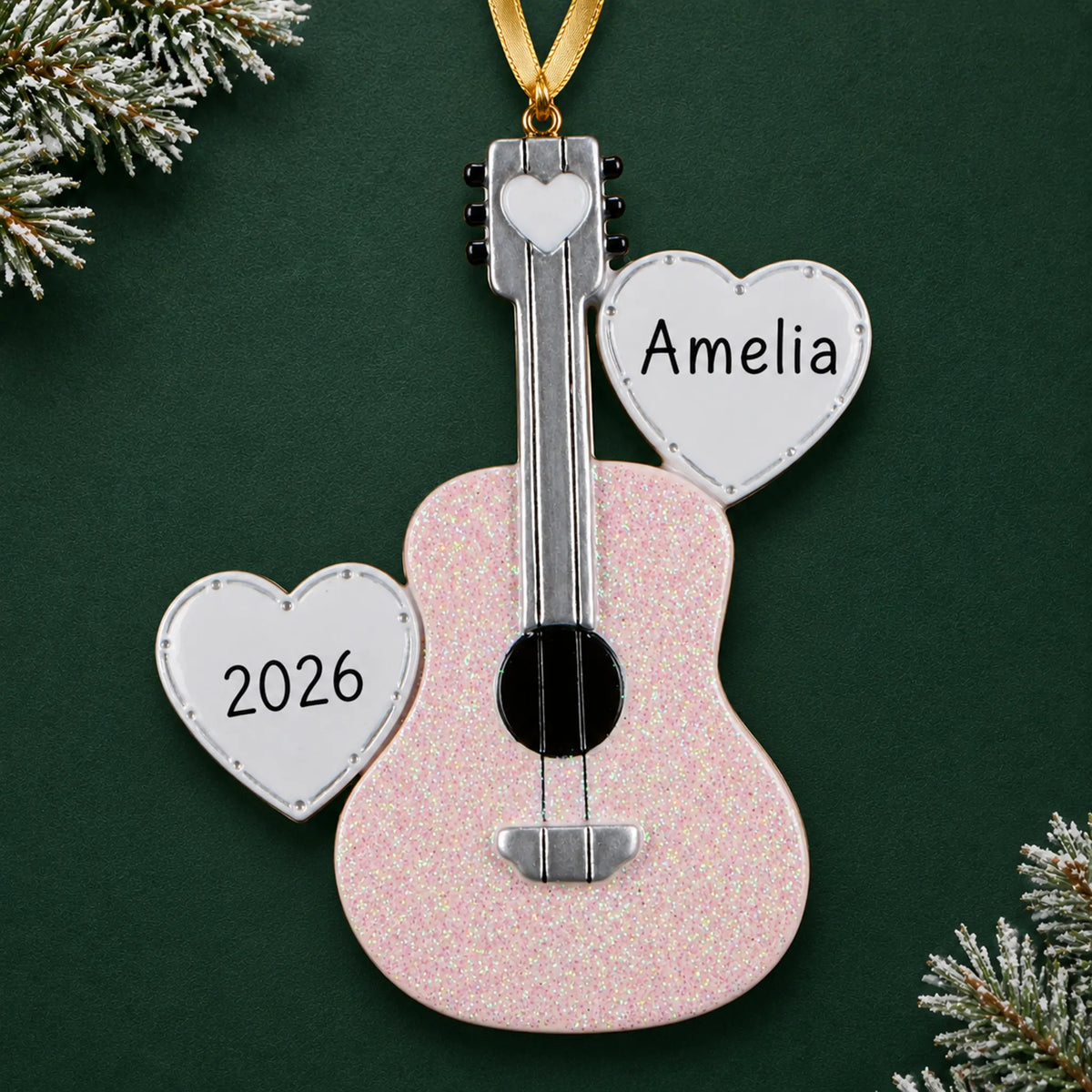 Personalized pink guitar christmas ornament on a dark green pine background