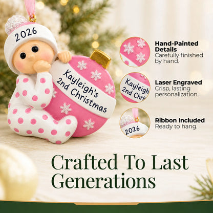 Hand-painted details and laser engraved personalization on the pink baby's 2nd christmas ornament, ribbon included