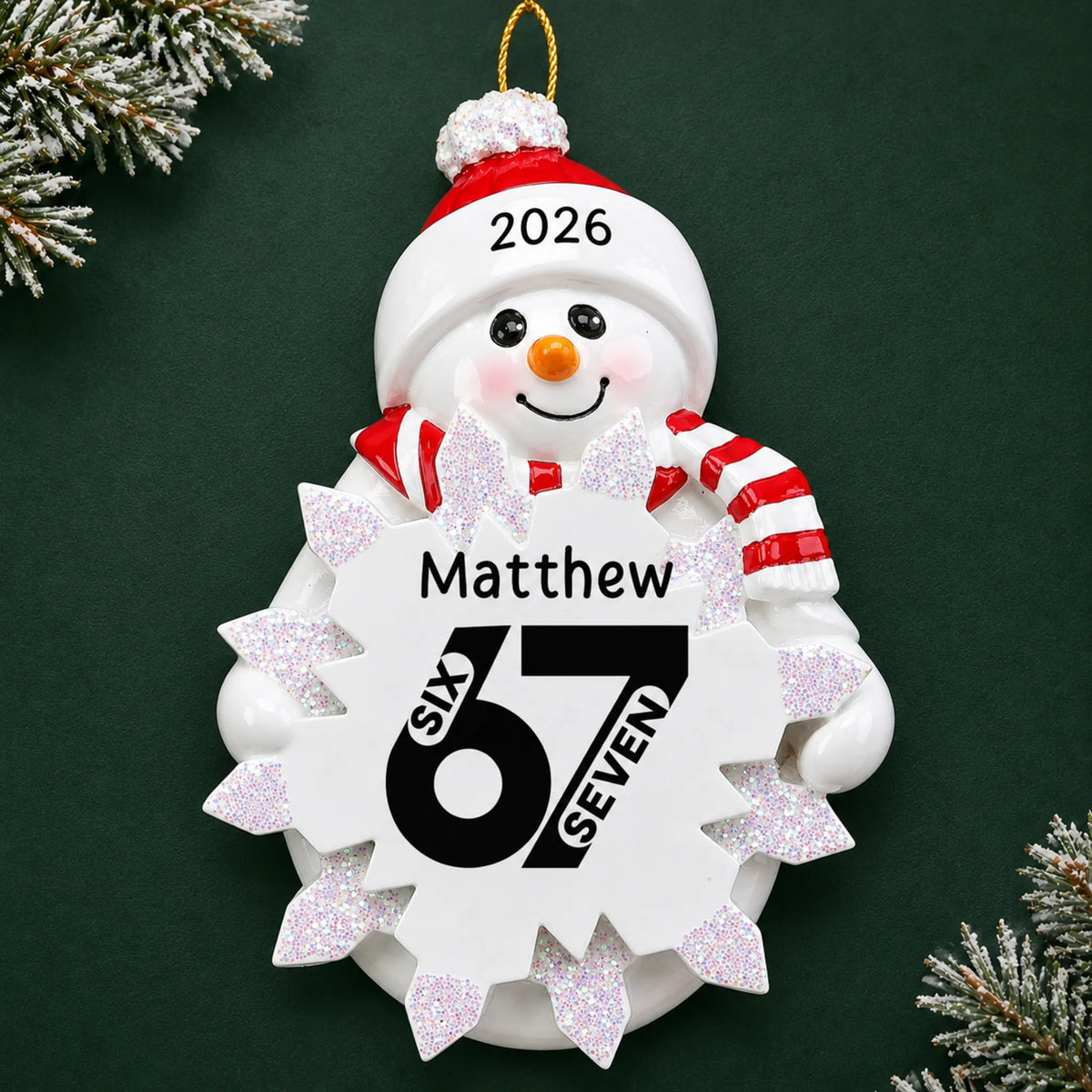 Personalized 6 7 viral slang christmas ornament on a dark green pine background