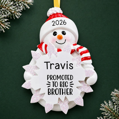 Personalized promoted to big brother christmas ornament on a dark green pine background