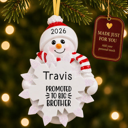 Promoted to big brother christmas ornament hanging on a lit Christmas tree with a Made Just For You gift tag