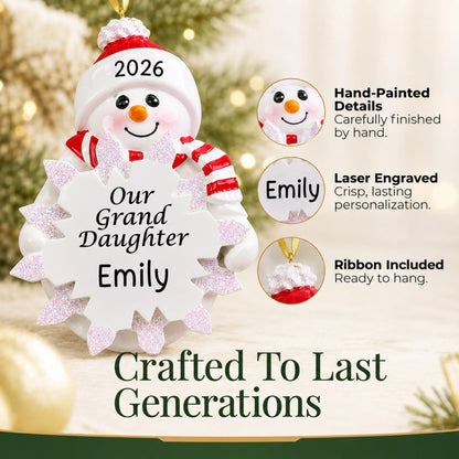 Hand-painted details and laser engraved personalization on the granddaughter snowman christmas ornament, ribbon included