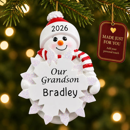 Grandson snowman christmas ornament hanging on a lit Christmas tree with a Made Just For You gift tag