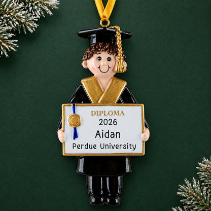 Personalized graduation boy Christmas ornament in black cap and gown holding a diploma with name, school and year