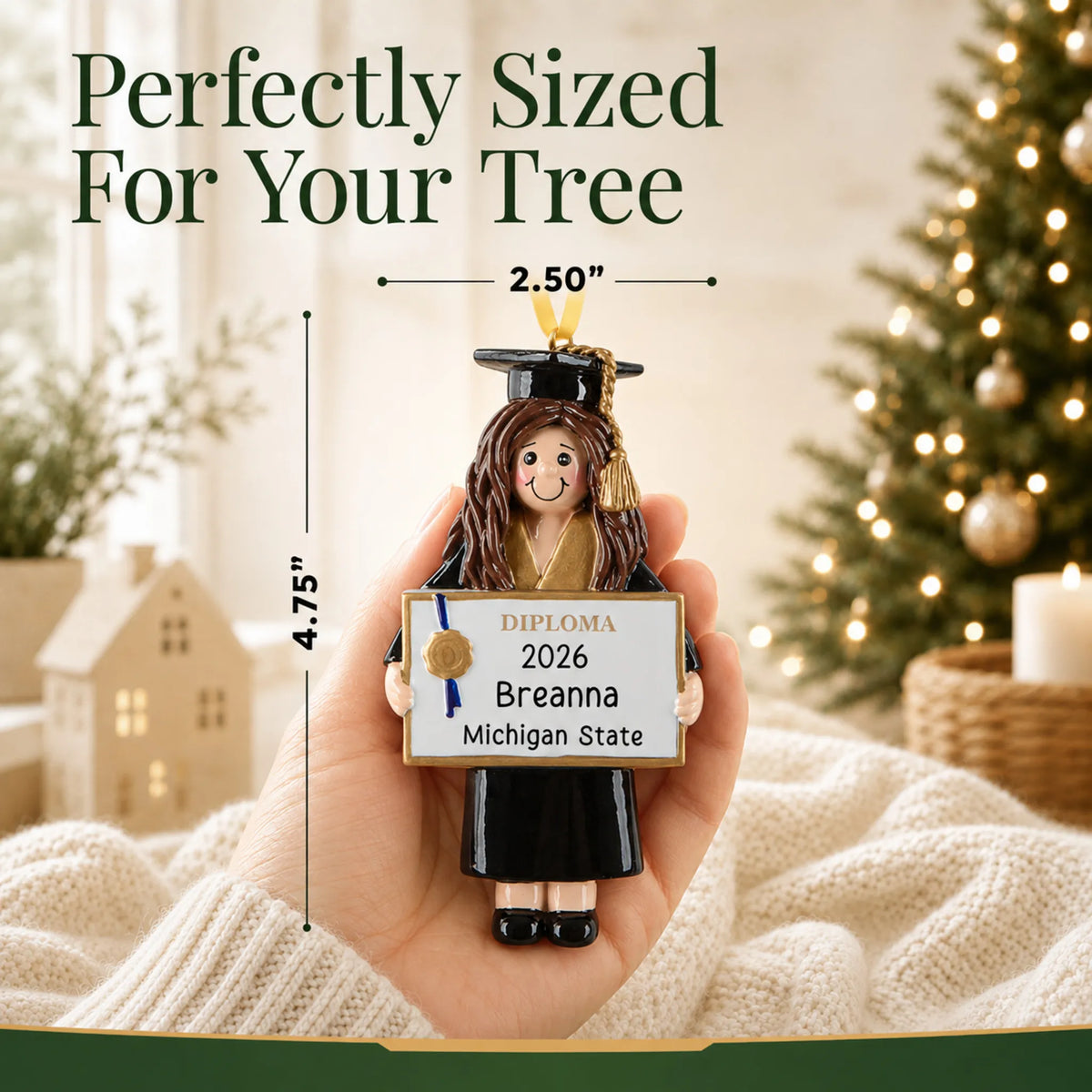 Personalized graduation girl Christmas ornament held in hand to show its 4.75 by 2.50 inch size