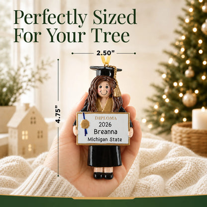 Personalized graduation girl Christmas ornament held in hand to show its 4.75 by 2.50 inch size
