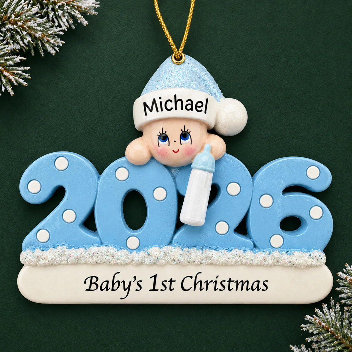 Personalized baby boy's 1st christmas 2026 ornament on a dark green pine background
