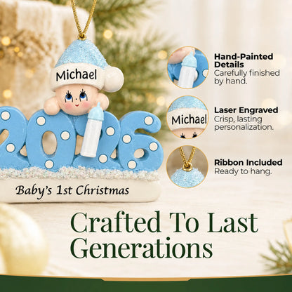 Hand-painted details and laser engraved personalization on the baby boy's 1st christmas 2026 ornament, ribbon included