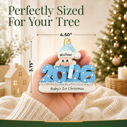 Size guide: the personalized baby boy's 1st christmas 2026 ornament is 4.50 in wide by 3.75 in tall, shown in hand