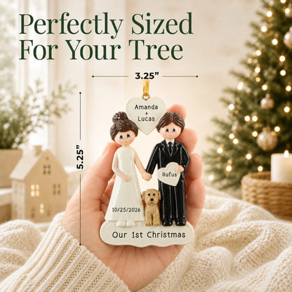 Size guide: the personalized Wedding Couple With Dog christmas ornament is 3.25 in wide by 5.25 in tall, shown in hand