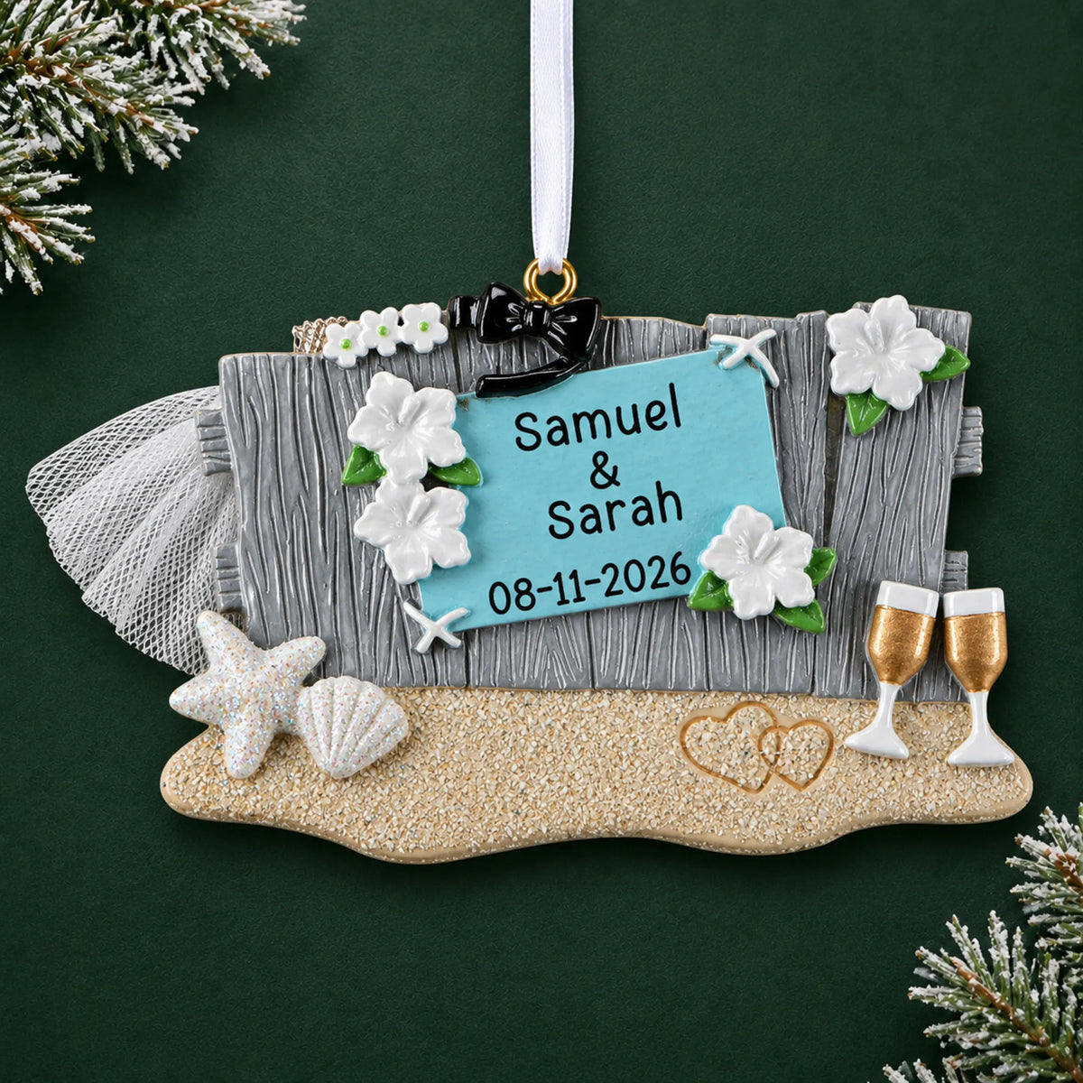 Personalized Beach Wedding christmas ornament on a dark green pine background