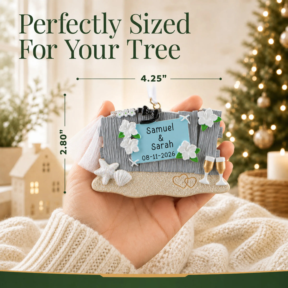 Size guide: the personalized Beach Wedding christmas ornament is 4.25 in wide by 2.80 in tall, shown in hand