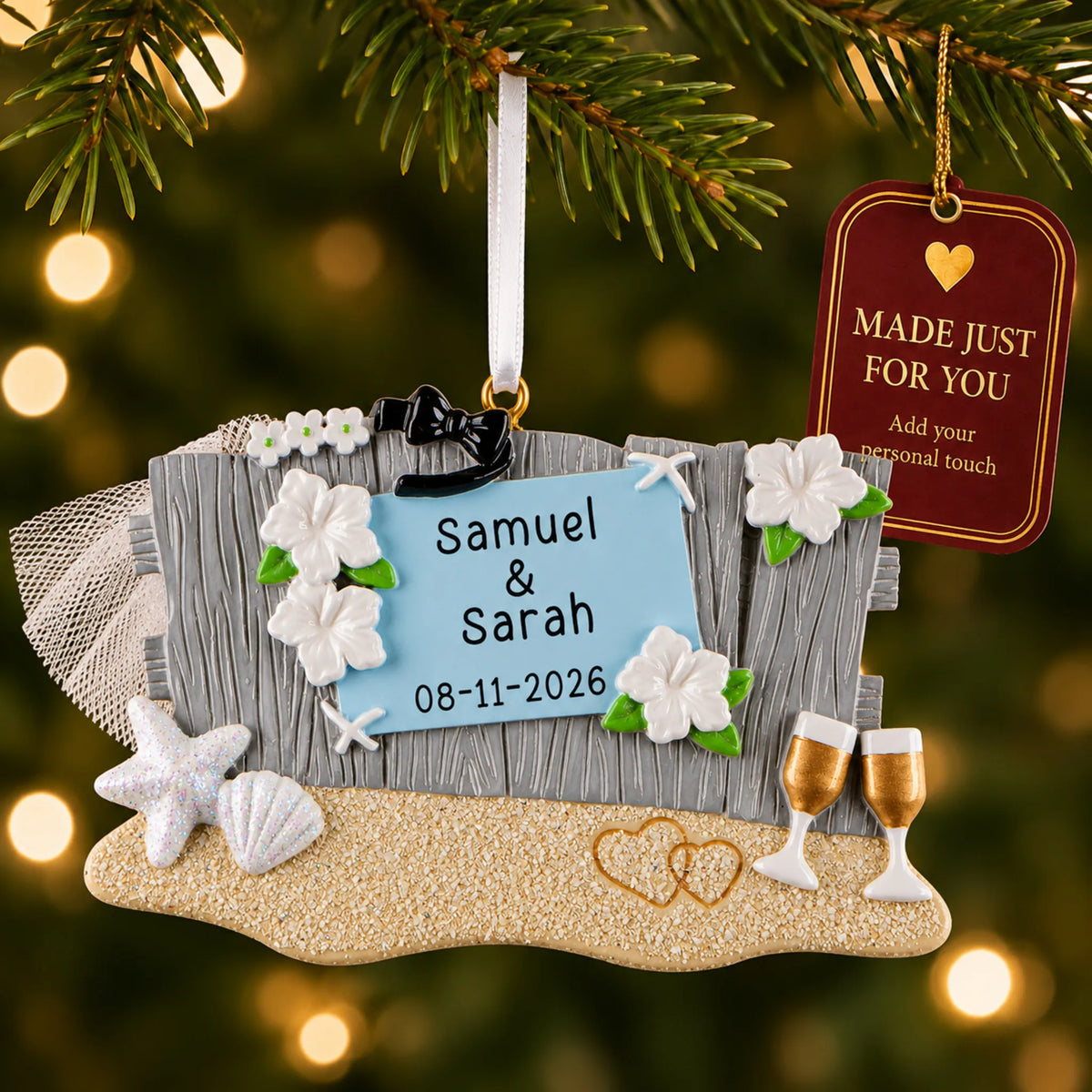 Beach Wedding christmas ornament hanging on a lit Christmas tree with a Made Just For You gift tag