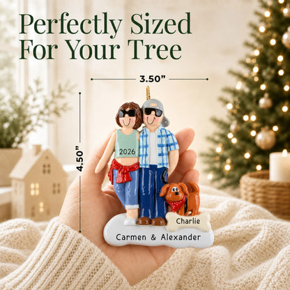 Size guide: the personalized cool couple with brown dog christmas ornament is 3.50 in wide by 4.50 in tall, shown in hand